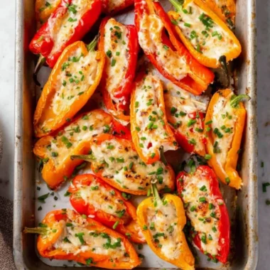 Cream cheese stuffed mini peppers on a platter