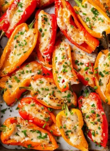 Cream cheese stuffed mini peppers on a platter