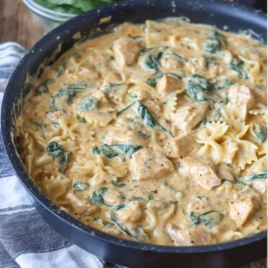 Dairy Free Chicken Alfredo served in a bowl with fresh herbs