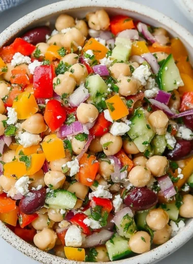 A colorful and nutritious dense bean salad with a variety of beans and veggies.