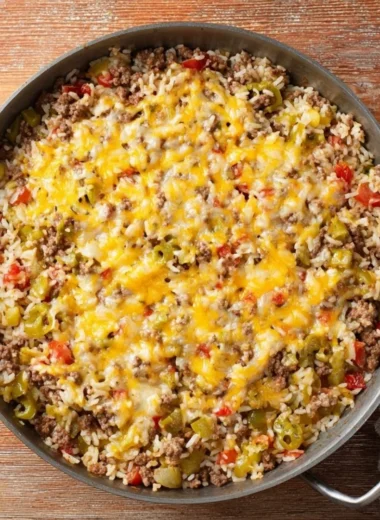 Delicious loaded beef and rice skillet meal served in a frying pan.