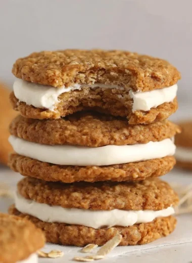 Delicious homemade oatmeal cream pies with creamy filling between soft cookies