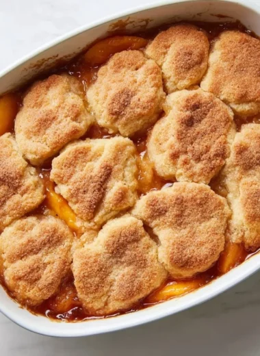 Delicious homemade Peach Cobbler with golden crust and juicy peaches