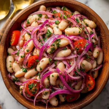 A bowl of Piyaz, traditional Turkish white bean salad with onions and parsley.