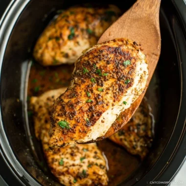 Tender slow cooker chicken breasts served with herbs and spices