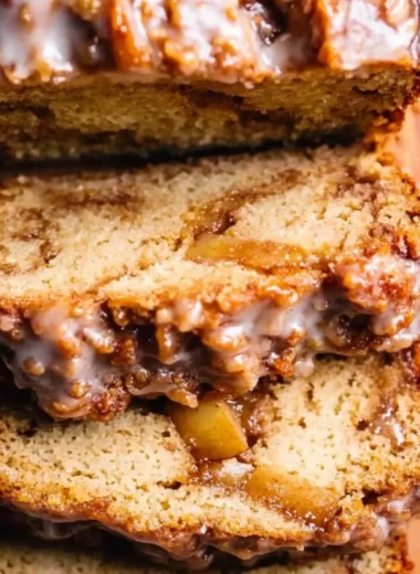 Delicious Amish apple fritter bread with chunks of apples and a sweet glaze.