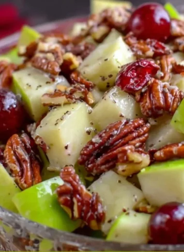 Fresh apple salad with mixed greens and dressing