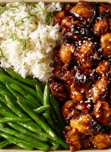 Healthy Asian high protein sesame chicken dish with sesame seeds and colorful vegetables