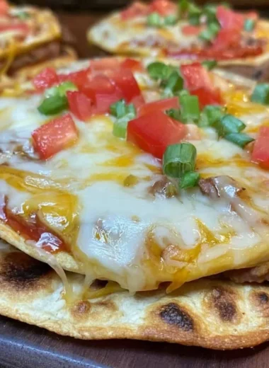 Delicious homemade Mexican pizzas inspired by Taco Bell's recipe.