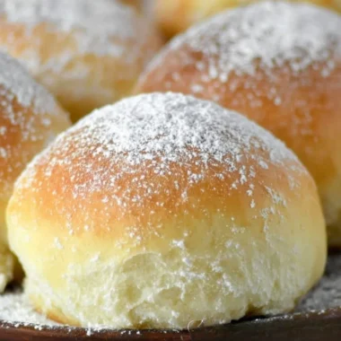 Freshly baked easy potato rolls on a wooden table