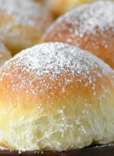 Freshly baked easy potato rolls on a wooden table