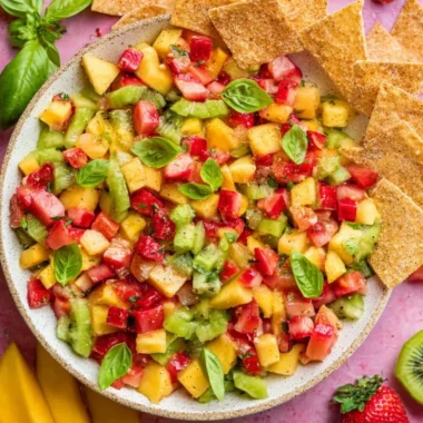 Fresh fruit salsa served with cinnamon sugar chips on a platter.