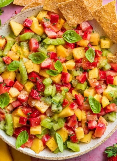 Fresh fruit salsa served with cinnamon sugar chips on a platter.