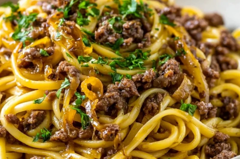 Delicious Garlic Butter Beef Pasta garnished with parsley and served in a bowl.
