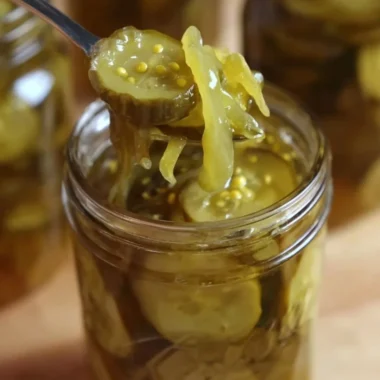 Jars of Granny's homemade bread and butter pickles on a kitchen counter