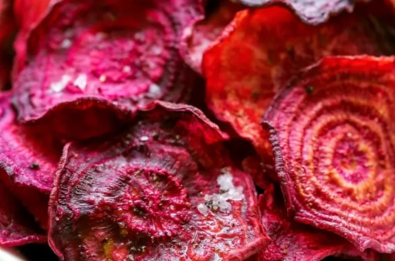 Healthy baked beet chips on a plate, perfect for guilt-free snacking.
