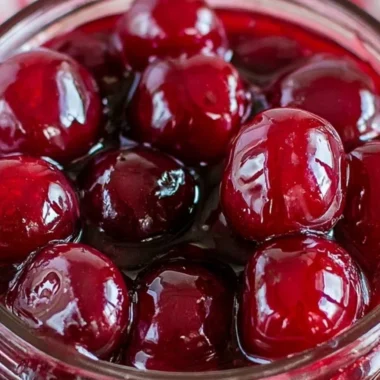 A bowl of homemade cherry sauce made with ripe cherries.
