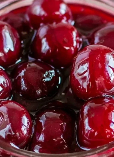 A bowl of homemade cherry sauce made with ripe cherries.