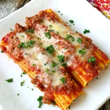 Delicious baked manicotti filled with Italian sausage and cheese