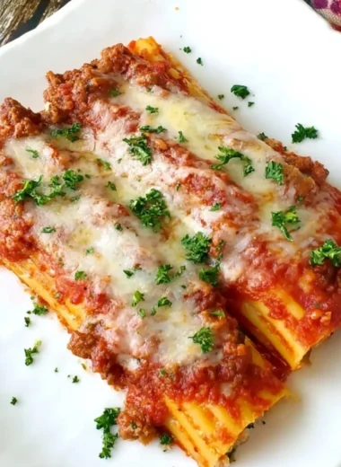 Delicious baked manicotti filled with Italian sausage and cheese
