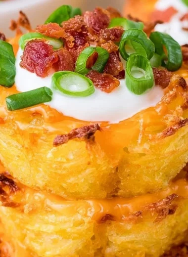 Delicious loaded tater tots appetizers topped with cheese and toppings.
