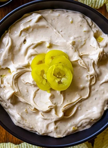 Delicious Mississippi Pot Roast Dip served in a bowl with garnishes
