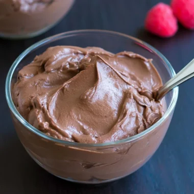 Bowl of rich Vegan Chocolate Pudding topped with fresh berries