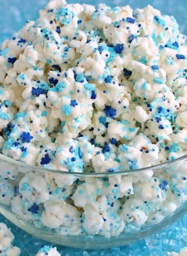 Winter Wonderland white chocolate popcorn, a festive sweet treat for winter celebrations.