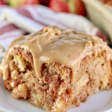 Deliciously moist Apple Dapple Cake with apples and nuts, topped with caramel