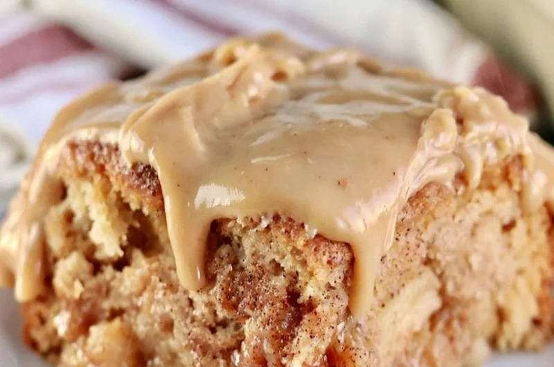 Deliciously moist Apple Dapple Cake with apples and nuts, topped with caramel