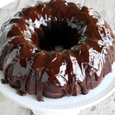 Delicious chocolate sour cream pound cake displayed on a cake stand