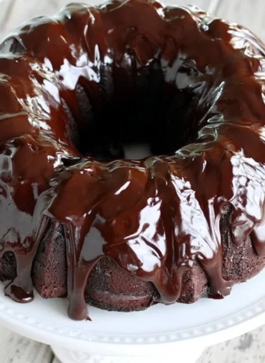 Delicious chocolate sour cream pound cake displayed on a cake stand