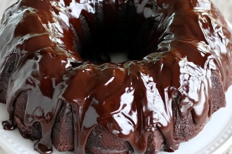 Delicious chocolate sour cream pound cake displayed on a cake stand