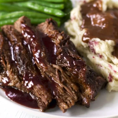 Juicy and tender Crock Pot Chuck Roast served with vegetables