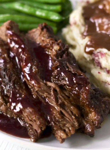 Juicy and tender Crock Pot Chuck Roast served with vegetables