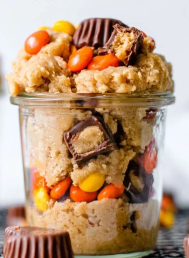 Delicious edible peanut butter cookie dough in a bowl with chocolate chips.