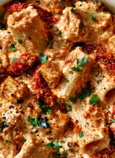 Creamy eggplant and sun-dried tomato ricotta pasta served in a bowl