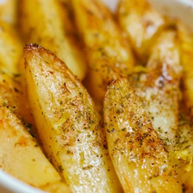Delicious Greek Lemon Potatoes, beautifully roasted and garnished.