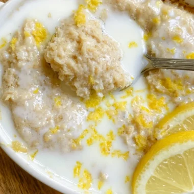 Delicious lemon baked oats with fresh lemon zest and a golden top