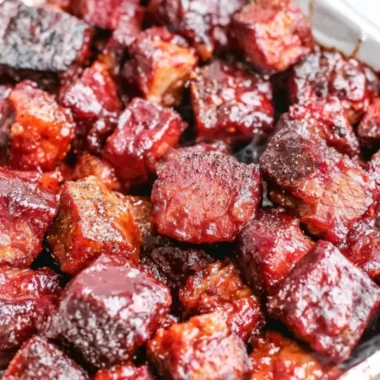 A delicious plate of Poor Man's Burnt Ends, smoky and flavorful BBQ dish.