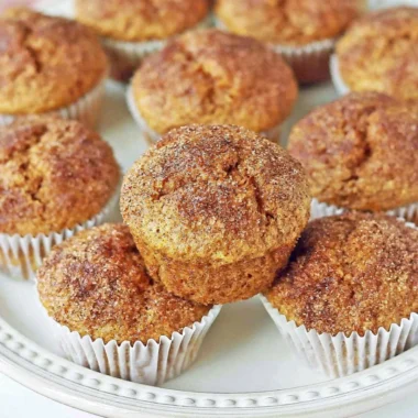 Freshly baked pumpkin muffins with spices and a golden brown top