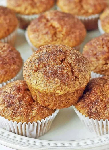 Freshly baked pumpkin muffins with spices and a golden brown top