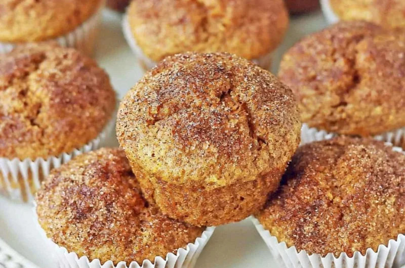 Freshly baked pumpkin muffins with spices and a golden brown top