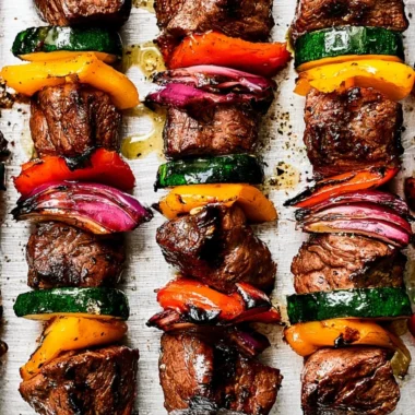 Grilled steak kabobs skewers with colorful vegetables and juicy meat