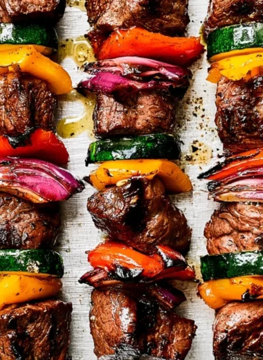 Grilled steak kabobs skewers with colorful vegetables and juicy meat
