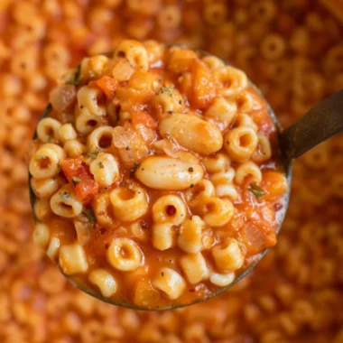 Delicious bowl of Pasta Fagioli Soup with beans and pasta garnished with herbs